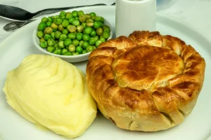 Steak and ale pie with seasonal vegetables and choice of mashed potatoes or chips at The Plough Inn, Hathersage in the Peak District